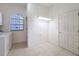 Laundry room with tile flooring and a window at 9237 Penelope Dr, Weeki Wachee, FL 34613