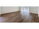 Open living space showcasing hardwood floors and neutral paint at 9237 Penelope Dr, Weeki Wachee, FL 34613