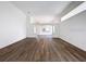 Open-concept living space featuring hardwood floors and neutral paint tones at 9237 Penelope Dr, Weeki Wachee, FL 34613