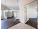 Open-concept living room featuring luxury vinyl flooring, high ceilings, and lots of natural light at 9237 Penelope Dr, Weeki Wachee, FL 34613