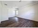 Spacious main bedroom with hardwood flooring, a ceiling fan, and plenty of natural light at 9237 Penelope Dr, Weeki Wachee, FL 34613