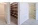 Pantry with multiple shelves and tiled floors at 9237 Penelope Dr, Weeki Wachee, FL 34613
