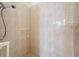 The shower room features tile walls and floor and a shower head at 9237 Penelope Dr, Weeki Wachee, FL 34613
