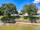 Lush backyard features mature trees and a serene view from the waterfront property at 9336 Santa Monica Way, New Port Richey, FL 34655