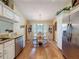 Dining area with hardwood floors, cabinetry and a window overlooking the exterior at 9336 Santa Monica Way, New Port Richey, FL 34655