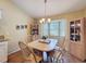 Dining area with hardwood floors, cabinetry and a window overlooking the exterior at 9336 Santa Monica Way, New Port Richey, FL 34655