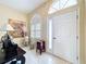 Bright foyer featuring tiled flooring, large windows, and neutral wall colors at 9336 Santa Monica Way, New Port Richey, FL 34655
