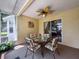 Enclosed lanai with decor and seating for four people at 9336 Santa Monica Way, New Port Richey, FL 34655