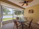 Enclosed lanai with lake view, and seating for four at 9336 Santa Monica Way, New Port Richey, FL 34655