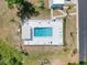 Aerial shot of the community pool featuring lounge chairs and a covered seating area at 9336 Santa Monica Way, New Port Richey, FL 34655