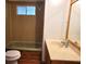 Bathroom featuring a shower-tub combo, vanity and window at 9441 Teak St, New Port Richey, FL 34654