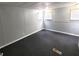 A carpeted bedroom with neutral paint and three windows at 9441 Teak St, New Port Richey, FL 34654