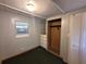 Bedroom with carpet flooring, closet, and natural light at 9441 Teak St, New Port Richey, FL 34654