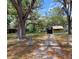Charming single Gathering home with a fenced yard and mature trees at 9441 Teak St, New Port Richey, FL 34654