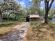 Charming single Gathering home with a carport and mature trees at 9441 Teak St, New Port Richey, FL 34654