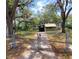 Charming single Gathering home with a fenced yard and mature trees at 9441 Teak St, New Port Richey, FL 34654