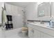 Bright bathroom with modern fixtures, tub-shower, and white vanity at 9640 Northcliffe Blvd, Spring Hill, FL 34608