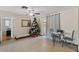 Cozy dining room area showcasing a Christmas tree, tile floors, and neutral paint at 9640 Northcliffe Blvd, Spring Hill, FL 34608