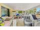 Enclosed patio/storage area with tile floors, natural light, and extra laundry equipment at 9640 Northcliffe Blvd, Spring Hill, FL 34608