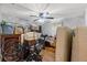 Organized storage room with ample storage space, fan, and flooring at 9640 Northcliffe Blvd, Spring Hill, FL 34608