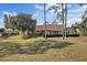 Expansive backyard featuring mature trees and well-maintained landscaping at 9652 Oakwood Hills Ct, New Port Richey, FL 34655