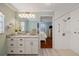 Bathroom boasts granite counters, white cabinetry, and walk-in shower at 9652 Oakwood Hills Ct, New Port Richey, FL 34655