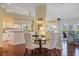 Charming dining area adjacent to kitchen featuring a glass top dining table at 9652 Oakwood Hills Ct, New Port Richey, FL 34655
