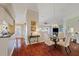 Open floor plan with a dining area featuring wood floors, a chandelier, and a decorative display niche at 9652 Oakwood Hills Ct, New Port Richey, FL 34655