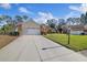 Charming home with a manicured lawn, two-car garage, and lovely stone accents at 9652 Oakwood Hills Ct, New Port Richey, FL 34655