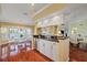 An open floor plan shows a kitchen and dining nook with black countertops and a chandelier at 9652 Oakwood Hills Ct, New Port Richey, FL 34655