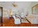 Spacious open-concept living room featuring hardwood floors and stylish furnishings at 9652 Oakwood Hills Ct, New Port Richey, FL 34655