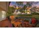 Inviting outdoor patio with comfortable seating and a colorful sky view at 9652 Oakwood Hills Ct, New Port Richey, FL 34655