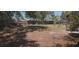 Large, private backyard is perfect for outdoor activities and features mature trees at 10347 Caspian St, Spring Hill, FL 34608