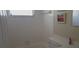 Bright bathroom features tiled walls, a window, and modern fixtures at 10347 Caspian St, Spring Hill, FL 34608