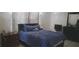 Comfortable bedroom with calm hues, large windows, and dark furniture at 10347 Caspian St, Spring Hill, FL 34608