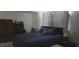 Relaxing bedroom features a comfortable bed, large windows, and calm hues at 10347 Caspian St, Spring Hill, FL 34608