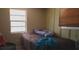 Simple bedroom with neutral walls, large window, and comfortable twin bed at 10347 Caspian St, Spring Hill, FL 34608