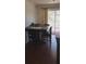 Cozy dining area featuring a wooden table, chairs, and sliding glass door to backyard at 10347 Caspian St, Spring Hill, FL 34608