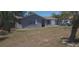 Charming single-story home with stucco exterior, palm tree, and driveway at 10347 Caspian St, Spring Hill, FL 34608