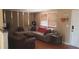 Comfortable living room with laminate floors, neutral walls, and plenty of natural light at 10347 Caspian St, Spring Hill, FL 34608