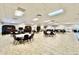 Spacious clubhouse featuring tables, chairs, and ample room for gatherings at 11041 Paradise Point Way, New Port Richey, FL 34654