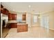 Spacious kitchen with granite countertops, tile floors, stainless steel appliances, and breakfast nook at 11041 Paradise Point Way, New Port Richey, FL 34654