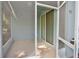 A screened in patio with a fan and tile floor at 11041 Paradise Point Way, New Port Richey, FL 34654