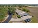Aerial view of the property showcasing its mature landscaping, parking, and surroundings at 11241 Dollar Lake Dr # 5, Port Richey, FL 34668