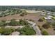 Overview of the neighborhood showcases a pond in the distance and an array of townhomes at 11241 Dollar Lake Dr # 5, Port Richey, FL 34668