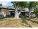 Backyard with mature trees providing shade, a patio, and well-maintained lawn, with views at 11241 Dollar Lake Dr # 5, Port Richey, FL 34668