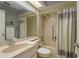 Cozy bathroom with shower-tub combination, neutral tile, updated fixtures and a large mirror at 11241 Dollar Lake Dr # 5, Port Richey, FL 34668