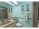 Ensuite bathroom features decorative tile, updated fixtures, and a glass shower at 11241 Dollar Lake Dr # 5, Port Richey, FL 34668