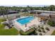 Relaxing community pool offers shaded lounge area, ample seating and manicured green spaces at 11241 Dollar Lake Dr # 5, Port Richey, FL 34668