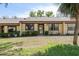 Inviting single-story villa showcasing a well-manicured lawn and quaint front entrance at 11241 Dollar Lake Dr # 5, Port Richey, FL 34668